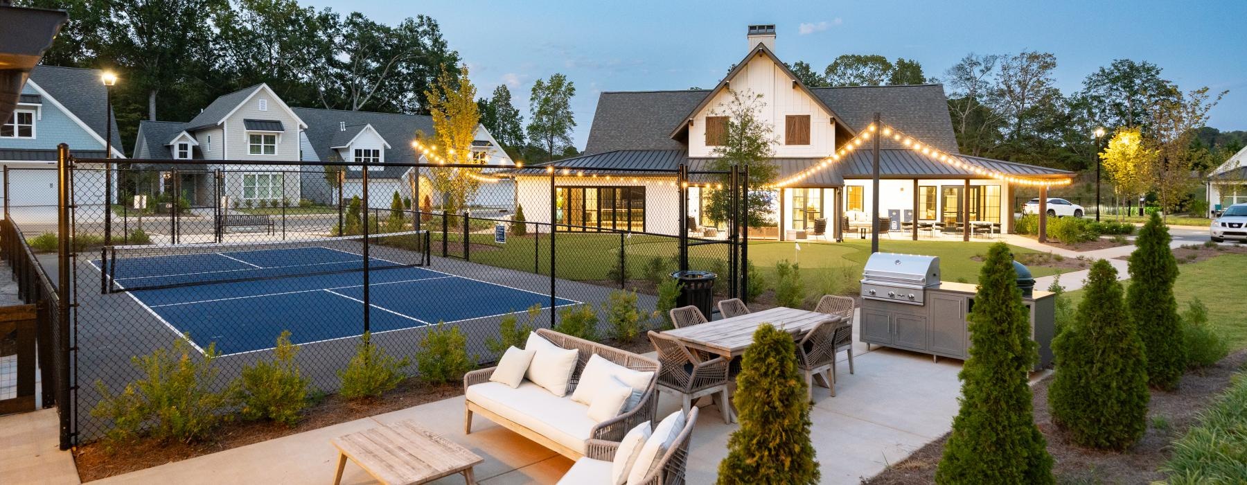a backyard with a swimming pool and a fence